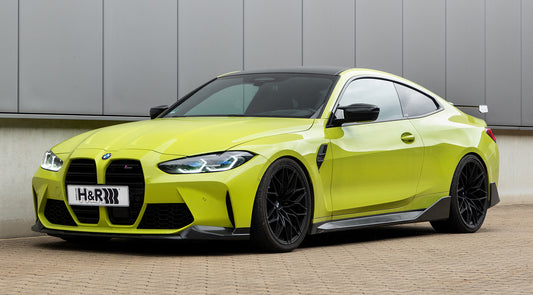 BMW M4 G82 Coupé in Gelb mit H&R-Kennzeichen, Frontansicht