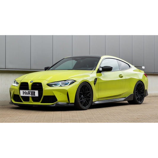 Beispielfahrzeug zu den H&R Gewindefedern: BMW M4 G82 Coupé in Gelb mit H&R-Kennzeichen, Frontansicht